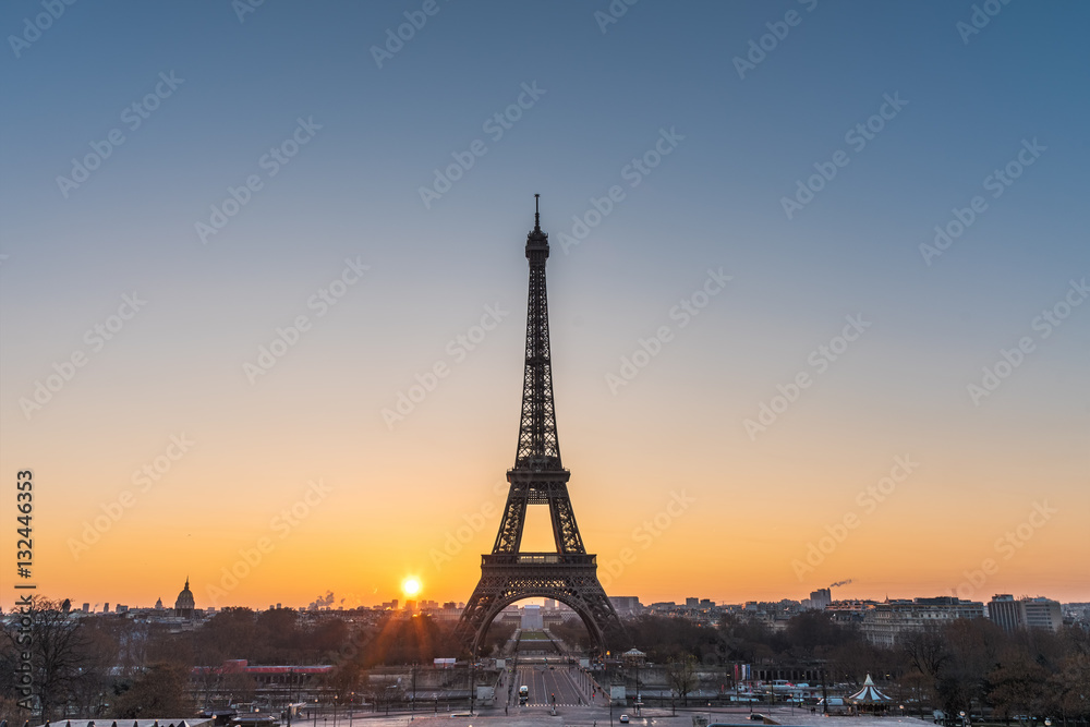 Landscape view of a warm sunrise over Paris and the Eiffel tower