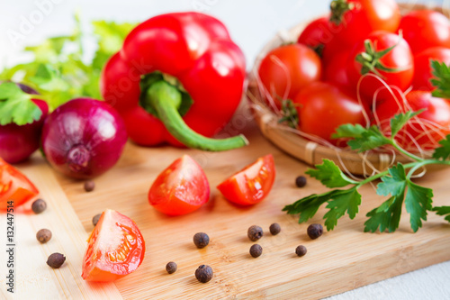 Fresh vegetables tomato and pepper on a light background in rustic style