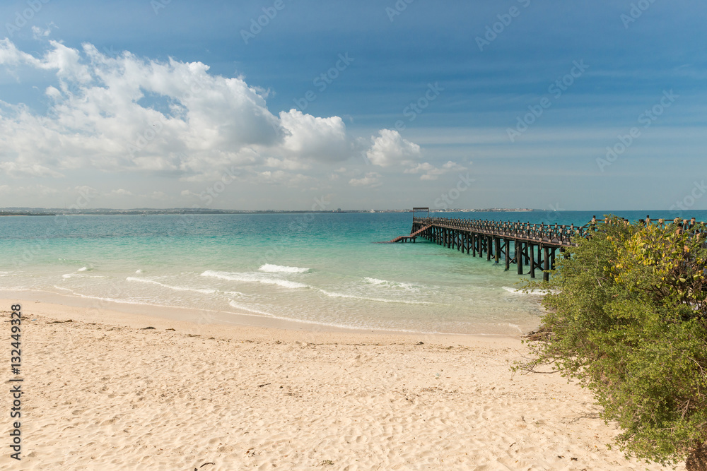 beautiful Zanzibar beach with pier in ocean