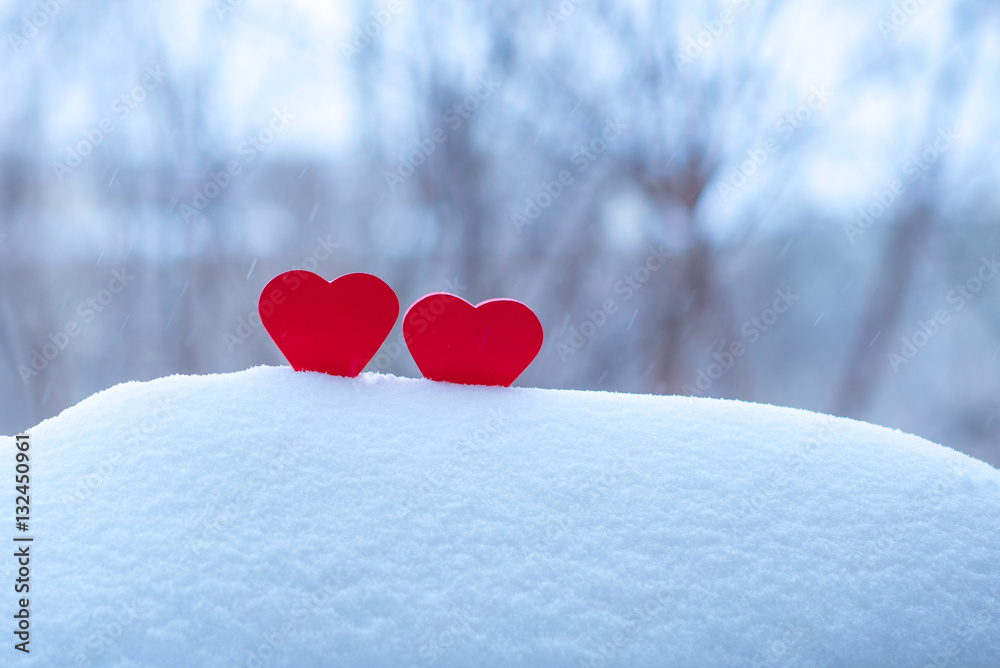 Fototapeta premium two beautiful hearts on a winter background