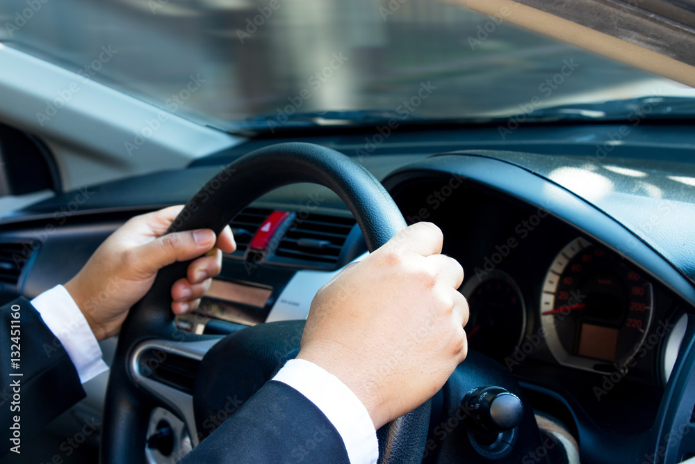 Businessman driving his car