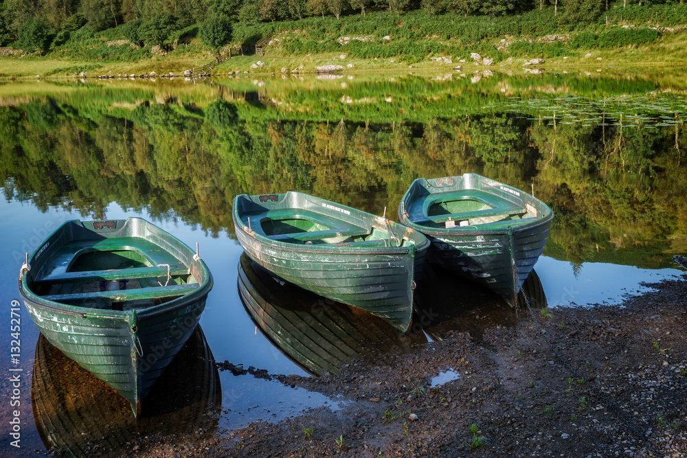 Rowing Boats Moored at Watendlath Tarn in the Lake District Cumb Rowing Boats Moored at Watendlath Tarn in the Lake District Cumb