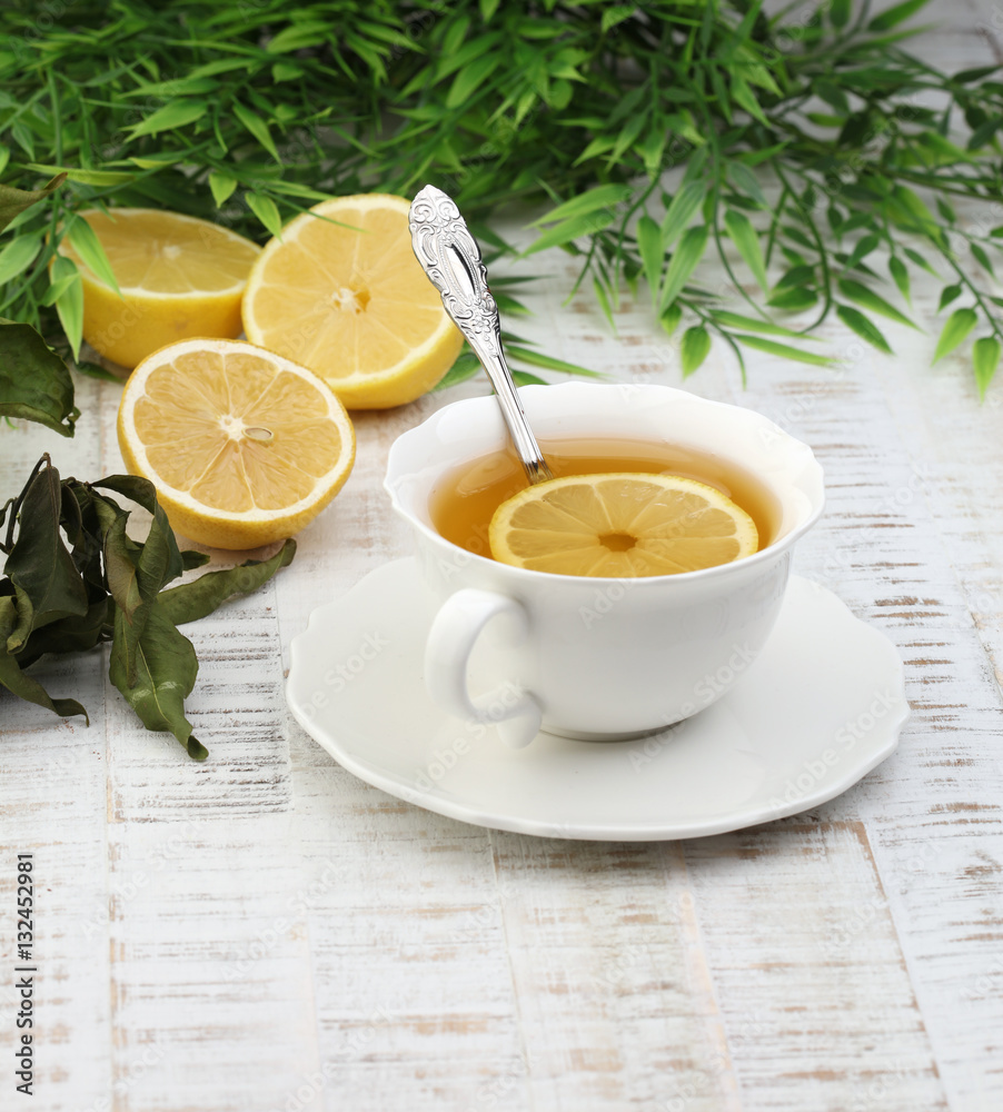 Tea. Herbal tea. Mint leaf. Tea in a glass cup, mint leaves, dried tea, sliced lime. herbs on a slate plate in a restaurant or teahouse Tea. Herbal tea. Mint leaf. Tea in a glass cup, mint leaves, dried tea, sliced lime. herbs on a slate plate in a restaurant or teahouse