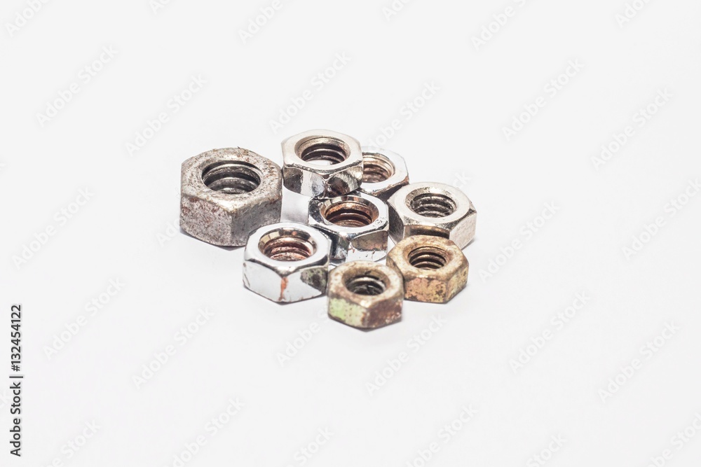 Used old bolts and nuts with isolated white background for commercial Used old bolts and nuts with isolated white background for commercial