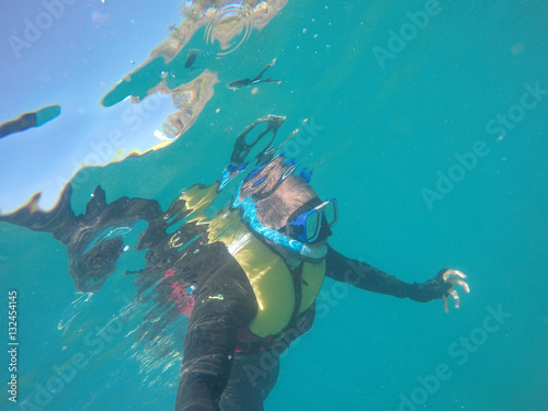 Scuba Diver Underwater taking a selfie in Whitsundays, Australia