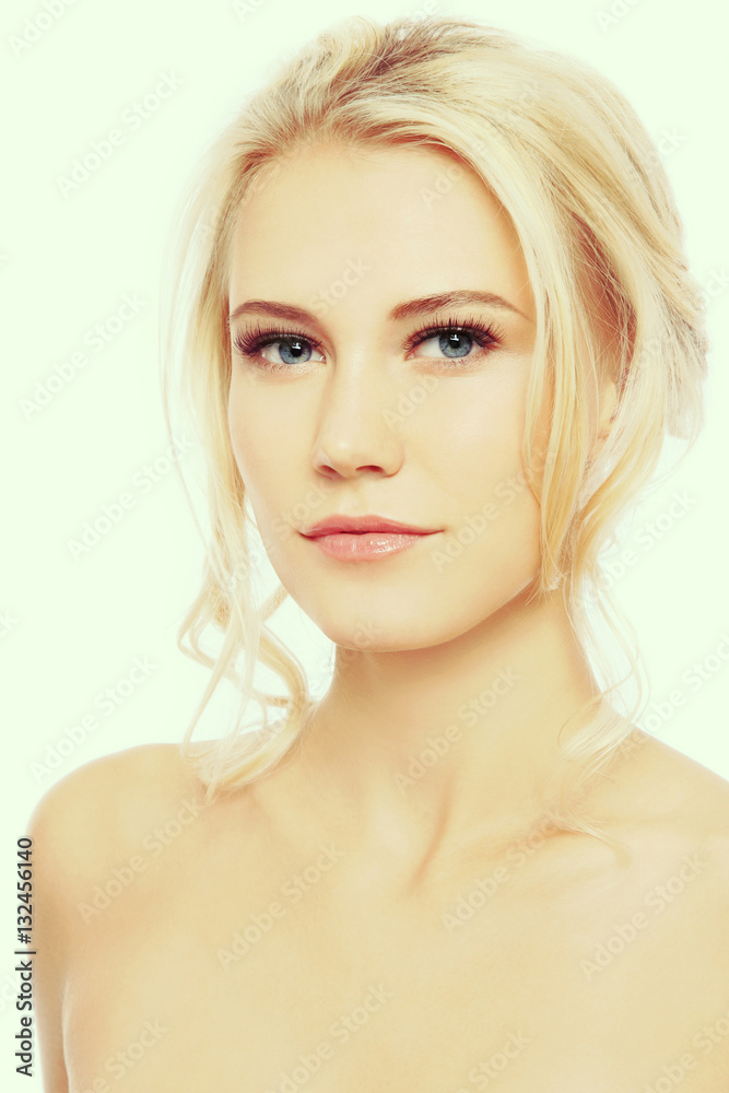 Fototapeta premium Vintage style portrait of young beautiful blond girl with clear make-up 