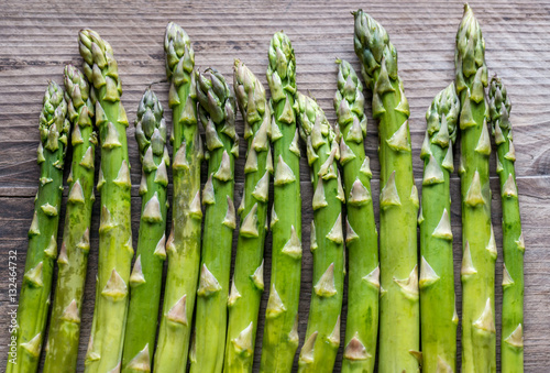 Fresh asparagus on the wooden background