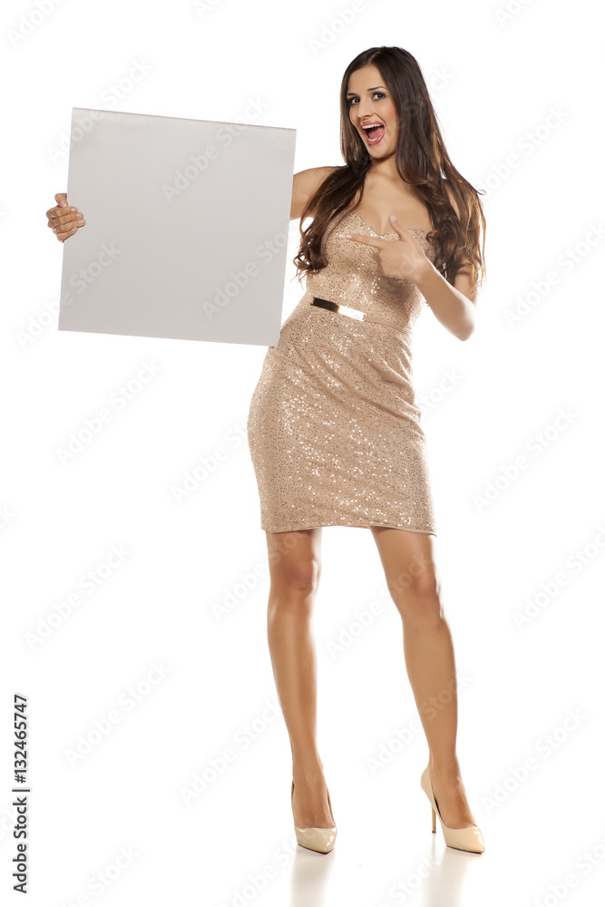 Advertising pretty woman in a short dress on white background Advertising pretty woman in a short dress on white background