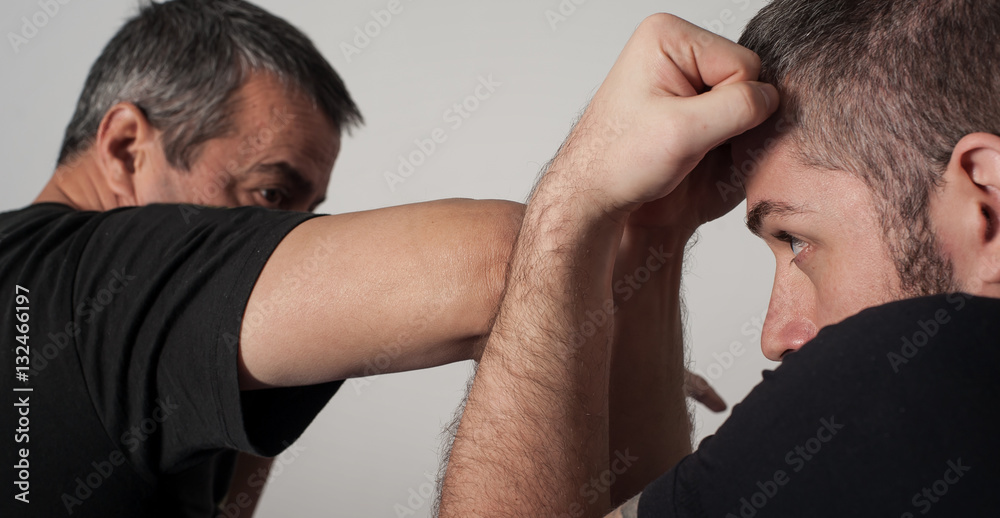 Fototapeta premium Kapap instructor demonstrates fighting techniques