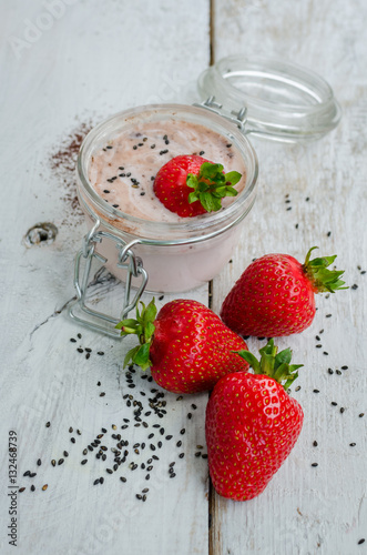 Homemade yogurt in a jar with strawberry