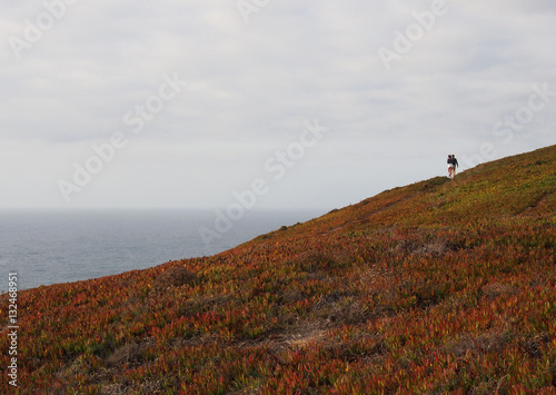 Couple walking along the Atlantic Ocean