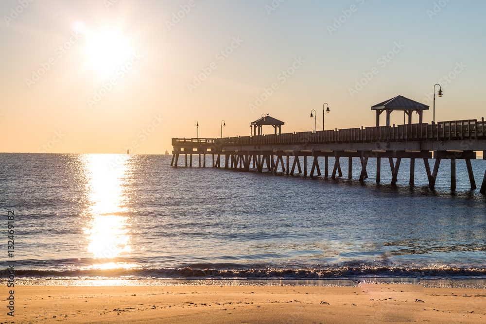 Dawn's early light on the fishing pier at Buckroe Beach in Hampton, Virginia.  