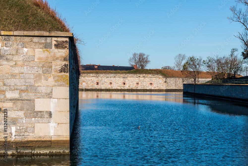 Fortress walls and moat of Fort Monroe National Monument in Hampton Virginia.