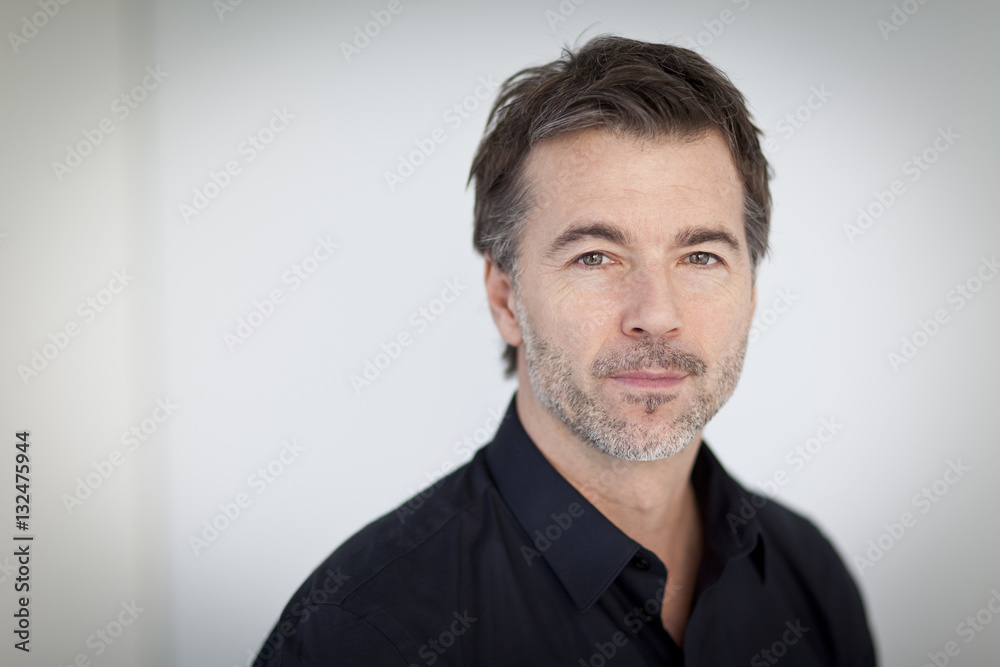 Fototapeta premium Portrait Of A Serious Handsome man Isolated On white