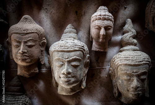 Closeup of the buddha face with light and shadow.