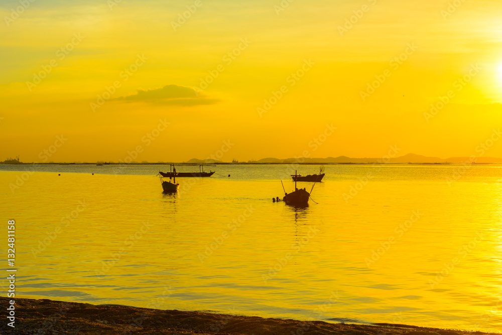 Beach and boat with warm light sunset background Beach and boat with warm light sunset background