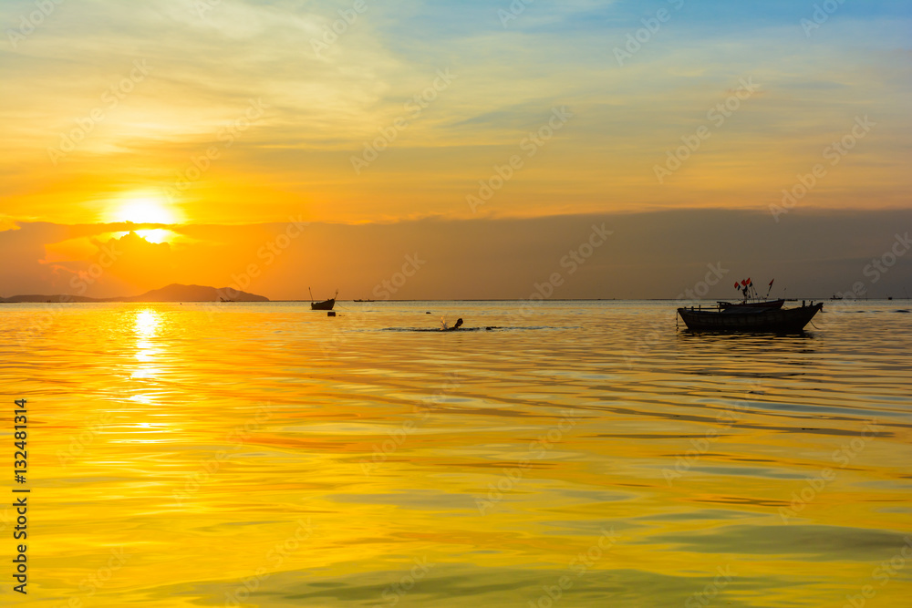 Beach and boat with warm light sunset background Beach and boat with warm light sunset background