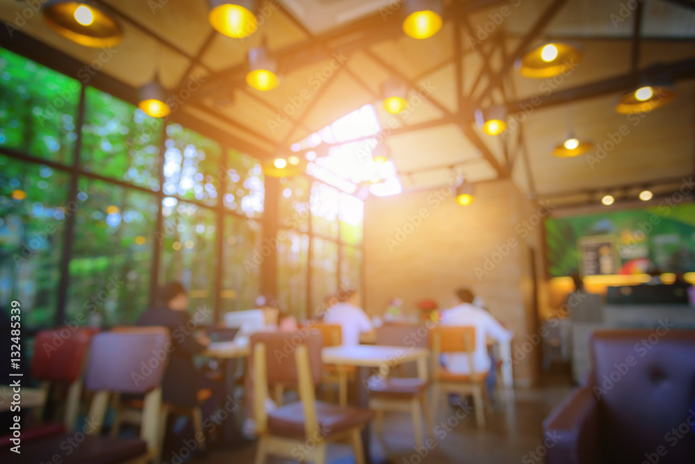 Blurred image coffee shop with abstract bokeh light background.