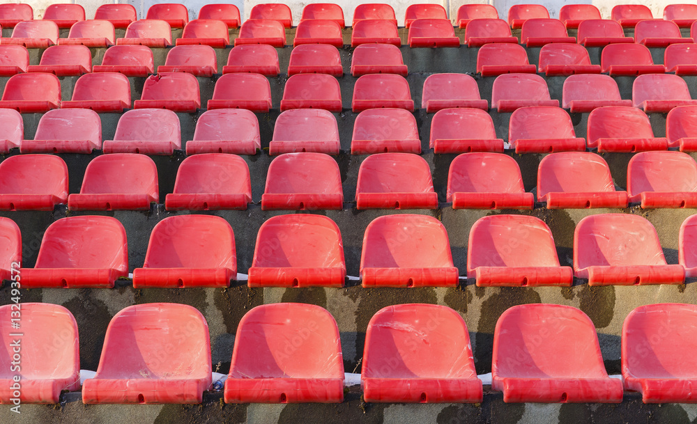 The old plastic seats in an abandoned stadium
