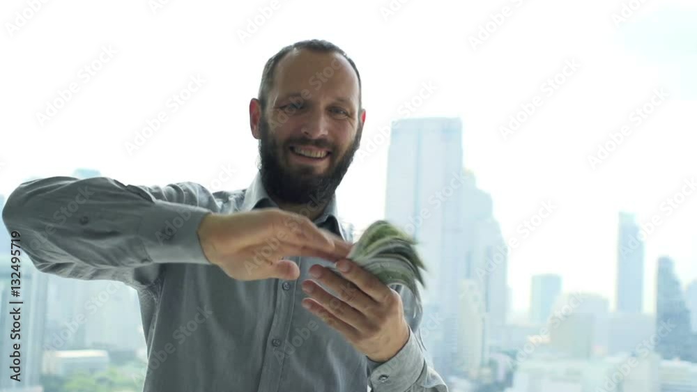 Happy, successful businessman throwing money to camera, super slow motion 240fps 
