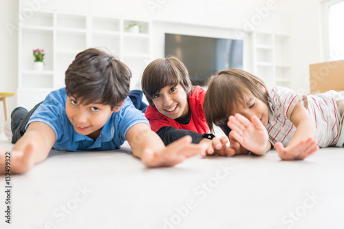 Children group on floor in house