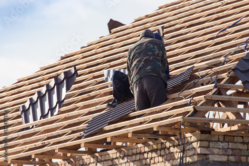 workers working on the roof