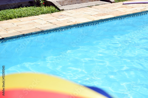 Sun umbrella  parasol  in front of a pool