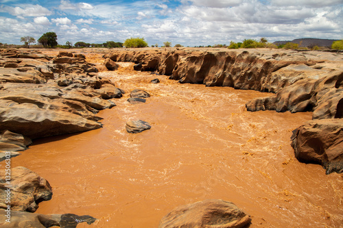 Galana river in Kenya, blue sky with clouds photo