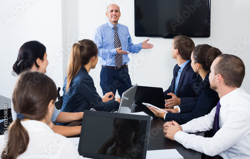 Coworker making presentation during business