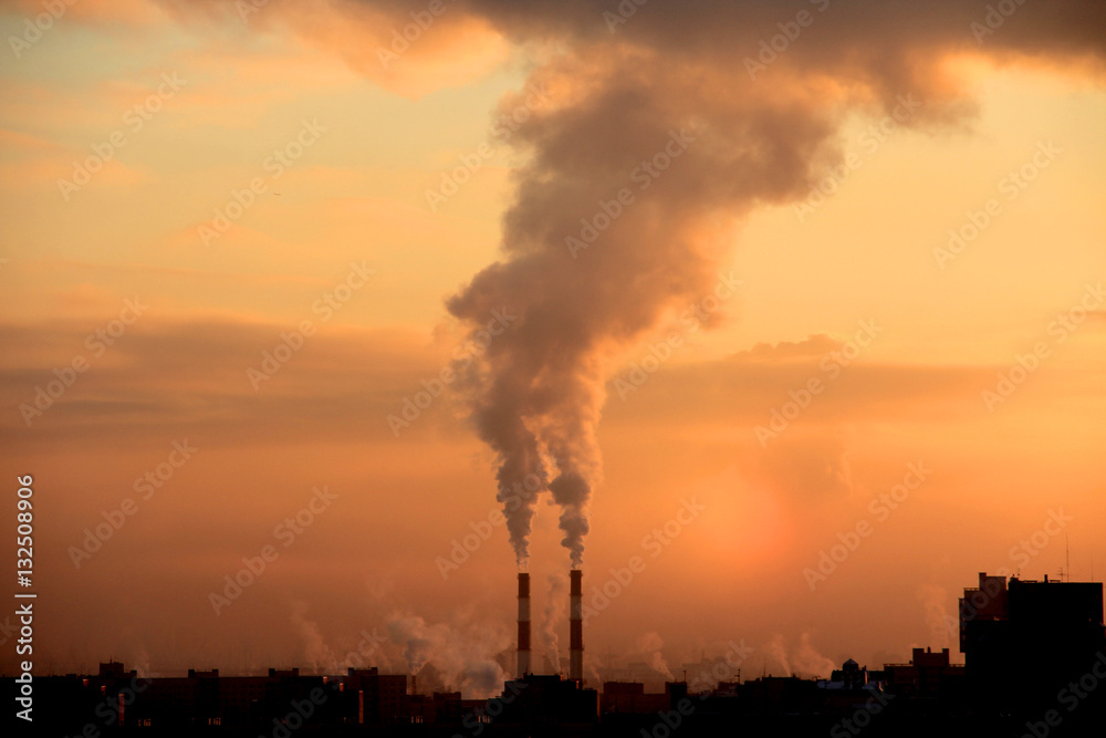 Smoke from industrial chimneys at dawn