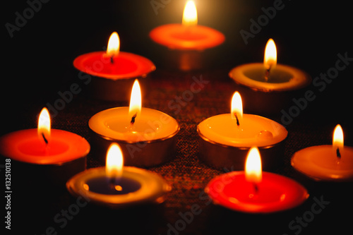Selective focus of Candle flame light at night with night background.