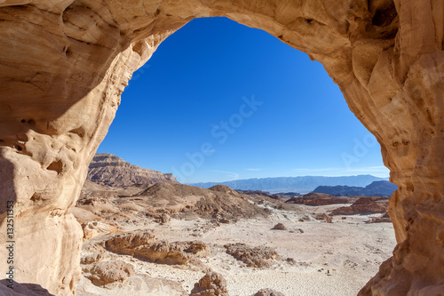 Timna park - The big arch with Desert landscape view photo