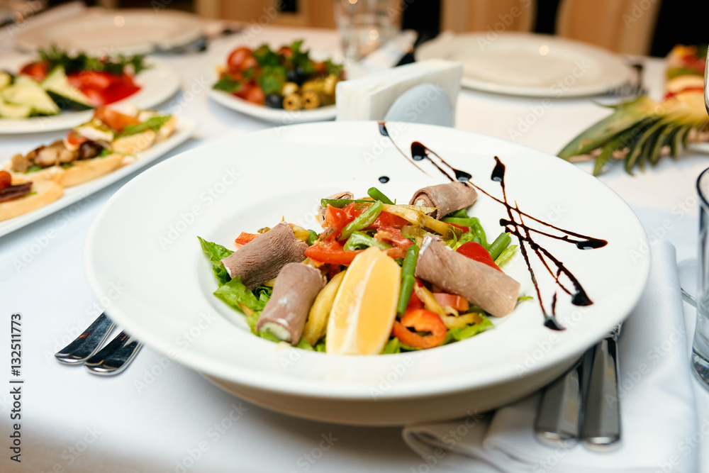 salad on a table in a restaurant salad on a table in a restaurant