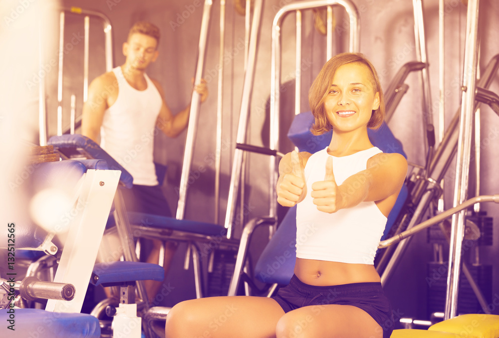Fototapeta premium Woman taking pause between exercising