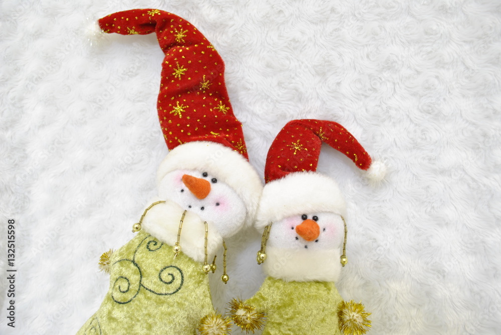 Two friends snowman/ snowmen next Toy on white background Two friends snowman/ snowmen next Toy on white background