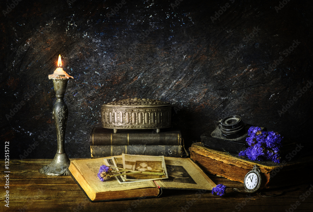 Classic still life with vintage books placed with illuminated