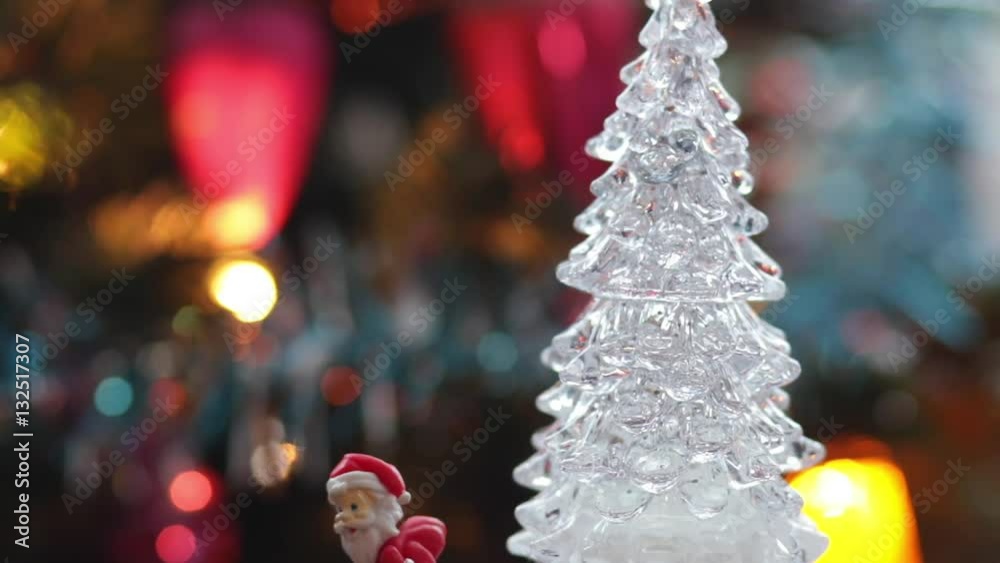 Toy christmas tree on the real christmas tree celebration background Toy christmas tree on the real christmas tree celebration background