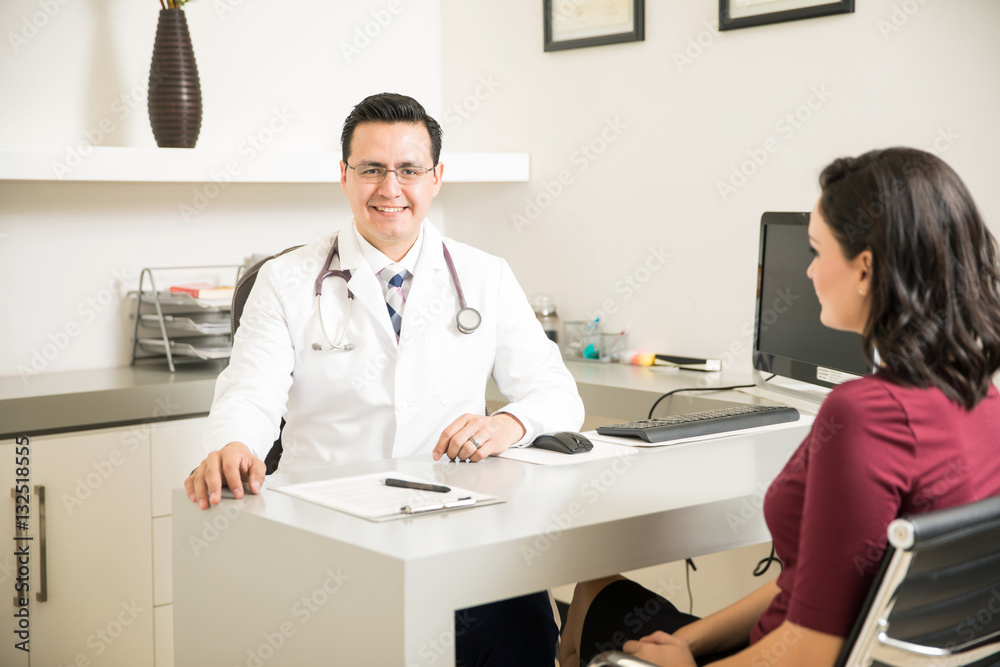 Handsome Hispanic doctor in an office