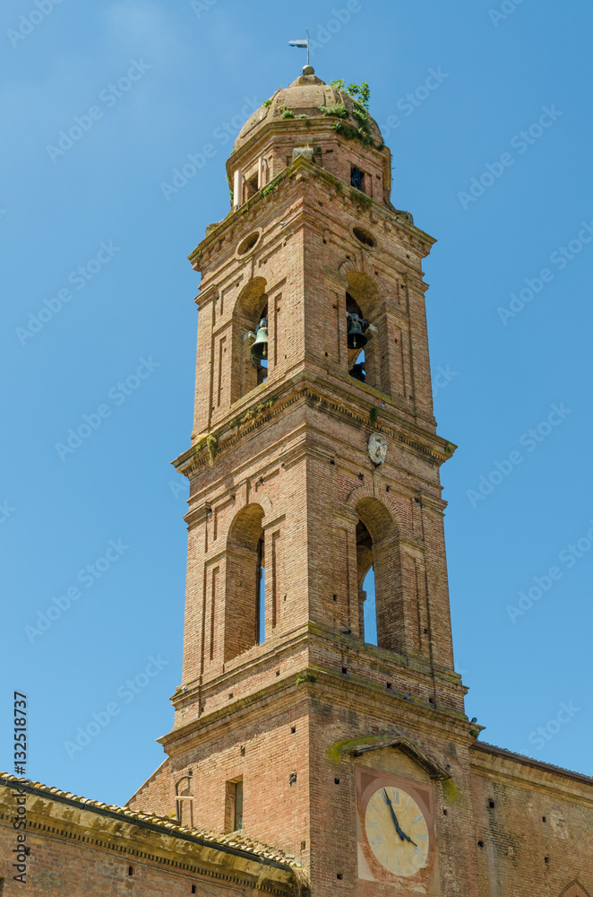 Typical historic Italian church tower with bells and clock in Siena, Italy, Europe