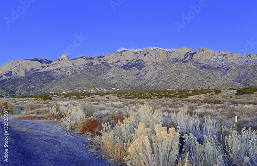 Sandia Peak and Sandia Crest just after sunset with ice and snow on summit, a popular mountain to hike and climb in New Mexico, USA, desert, arid, dry, four corners USA, landscape,