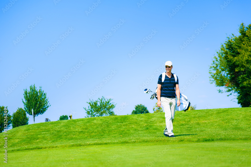 Man Walking To His Golf Ball