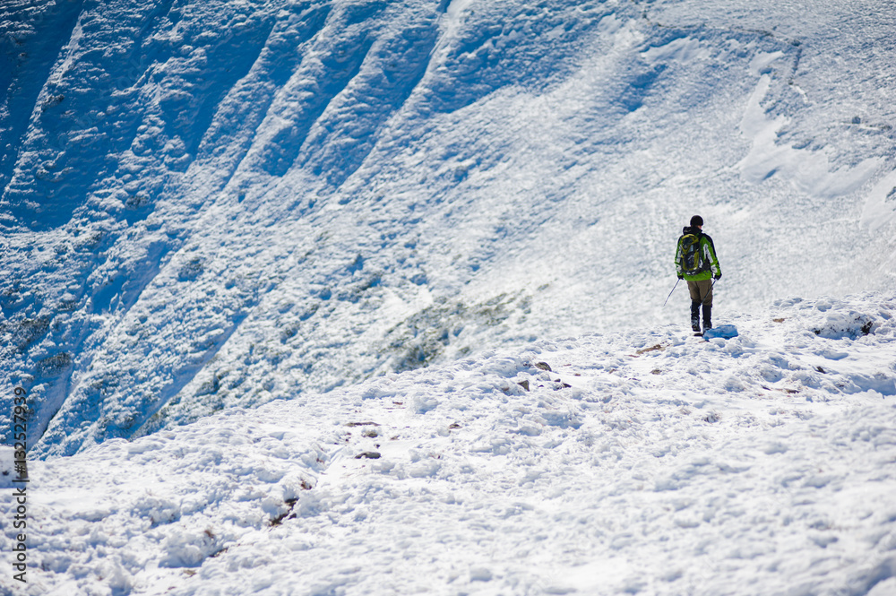 Climbing in the mountains in winter Climbing in the mountains in winter
