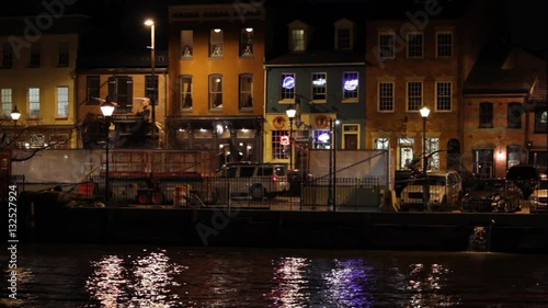 Shot of Fells Point, Baltimore over the water at night.