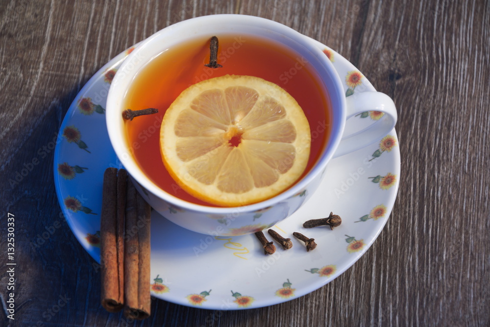 cup of tea with lemon and cloves cup of tea with lemon and cloves