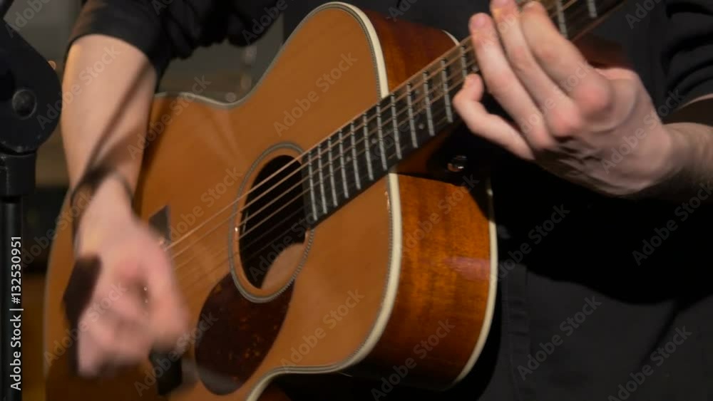 playing acoustic classical guitar with picks, close up,unrecognizable musician playing acoustic classical guitar with picks, close up,unrecognizable musician
