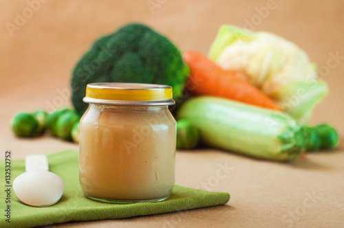 Glass jar with natural baby food vegetable puree