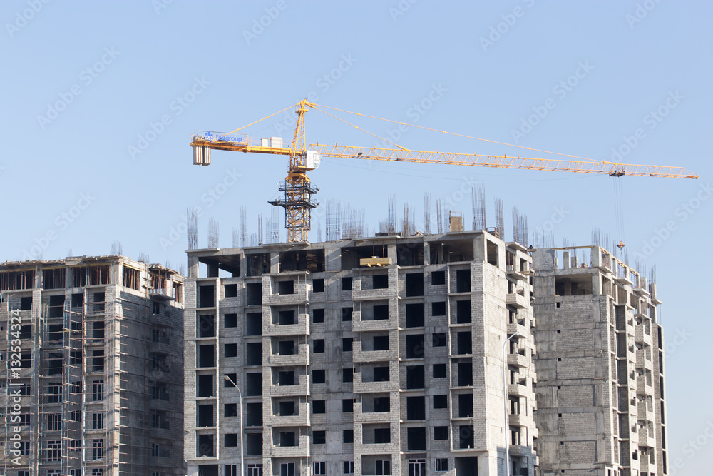 Crane building a multi-storey building Crane building a multi-storey building