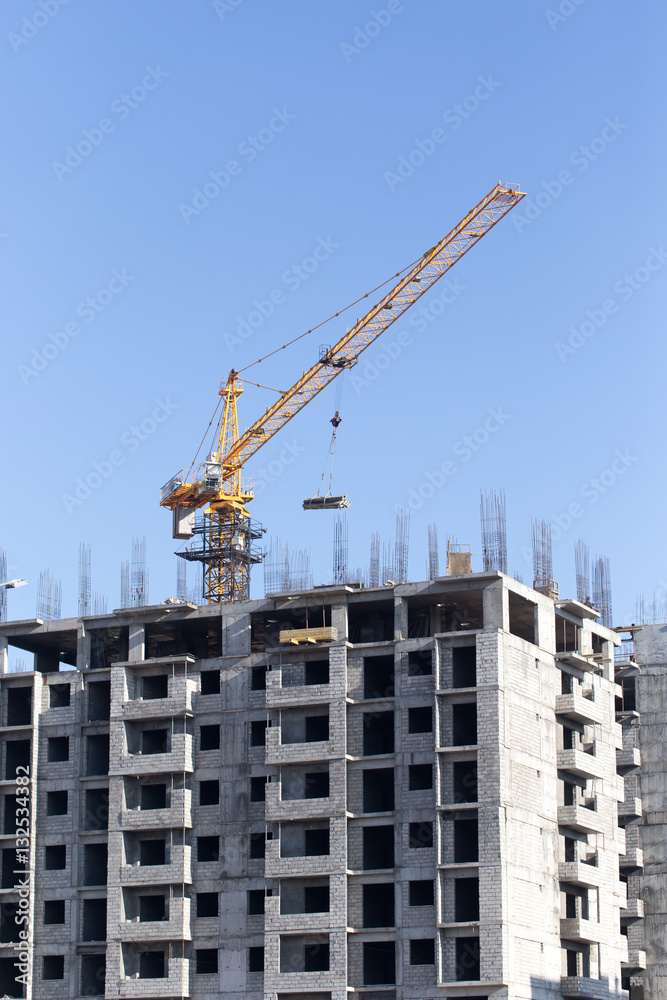Crane building a multi-storey building Crane building a multi-storey building