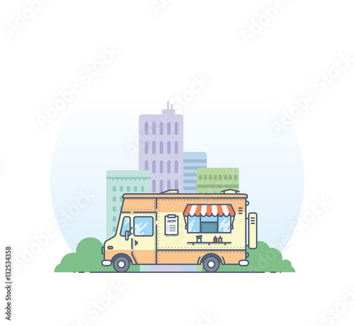 Fast food truck staying front of the big city.