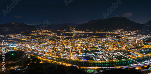 Fototapeta Naklejka Na Ścianę i Meble -  Night skyline of city in mountain valley, Trento, Italy